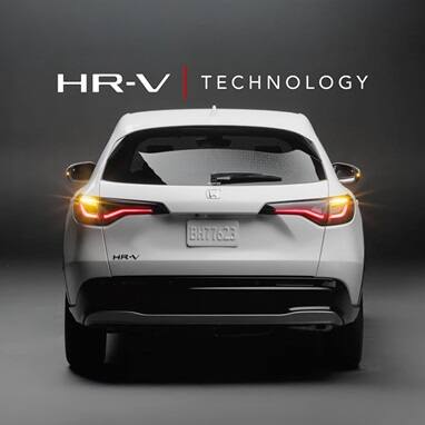 2027 Honda HR-V EX-L in Platinum White Pearl rear view in a studio with HR-V Technology text (Subcompact Crossover SUV).
